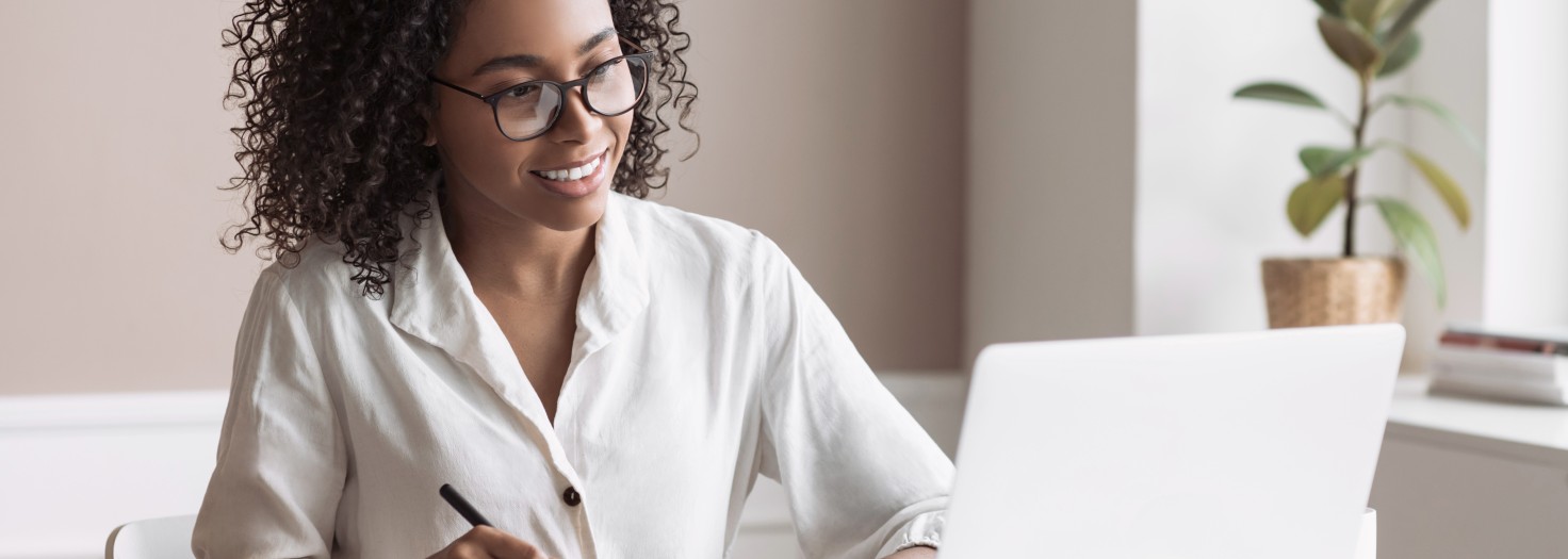 Freelancer woman working on laptop computer at home